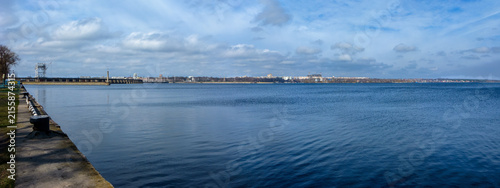 Canvas Print Historic DniproGES dam and residential buildings on a right bank of Dnipro as se