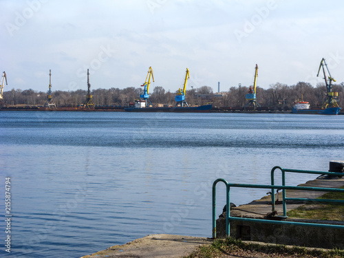 Obraz na plátně Yellow-Blue Cranes in Fright River Port of Zaporizhzhia, Ukraine