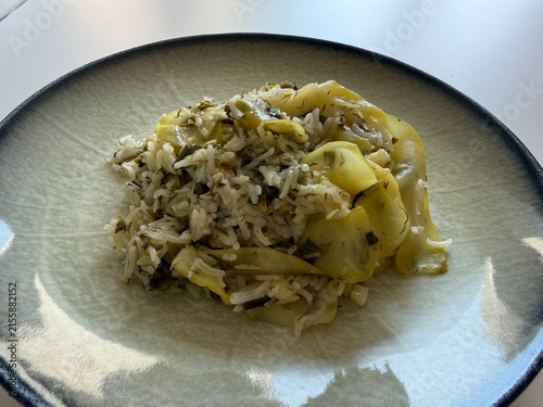Delicious Mediterranean Style Rice with Zucchini Ribbons and Fresh Dill Served on a Modern Ceramic Plate