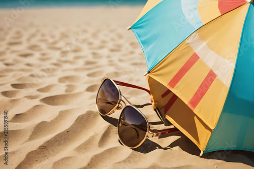 summer beach with sunglasses and umbrella