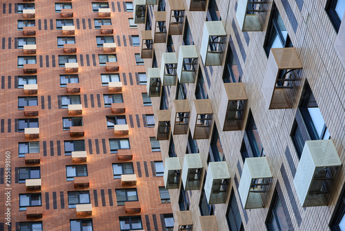 New residential buildings with boxes for air conditioners. House development, high-rise construction