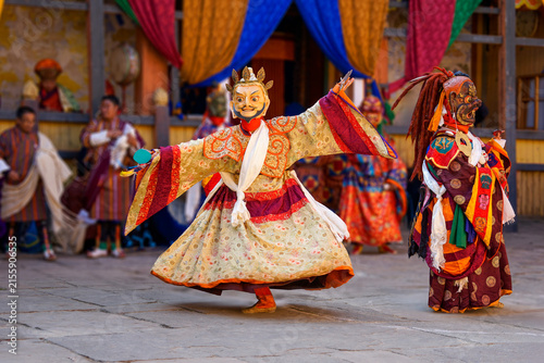 Bumthang in Bhutan, at the yearly festival in the monastery of Jakar. A monk is dancing in his colourful traditional dress and mask