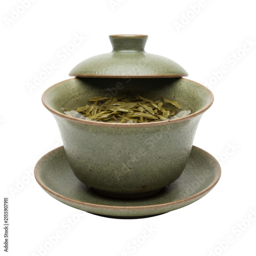 Traditional Chinese ceramic gaiwan tea cup with loose green tea leaves