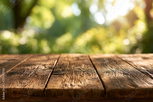 Rustic wooden table surface with a blurred natural green garden background, perfect for product display or food photography