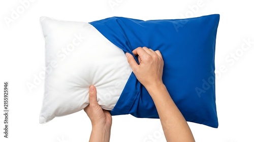 Hands placing a blue pillowcase over a white pillow on a clean background
