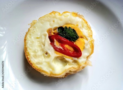 Fotografie Egg cooked on white plate