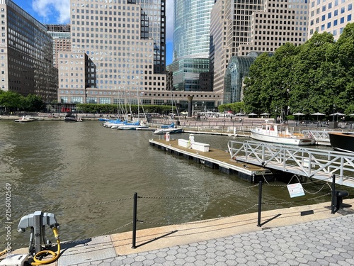 New York City, New York, USA - March 24, 2025: Looking across North Cove Marina toward docked yachts and the high-rise office buildings of Brookfield Place in Battery Park City, Lower Manhattan.