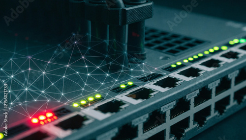 A close-up of an enterprise network switch with glowing status LEDs, overlaid with a digital wireframe mesh symbolizing active intrusion prevention.  
