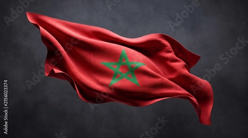 Waving Moroccan flag isolated against a dark background with dramatic fabric folds.