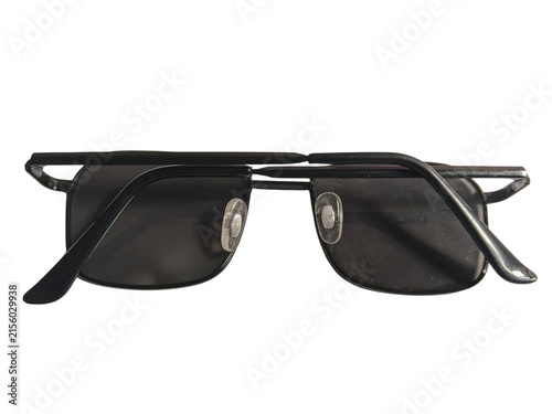 Folded black metal frame sunglasses with dark lenses isolated on white