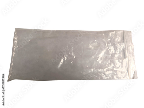 Transparent plastic bag filled with white powder isolated on white background