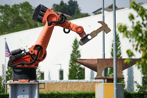 Industrial robot sculpture symbolizing automation and the use of robotics for heavy-duty work.