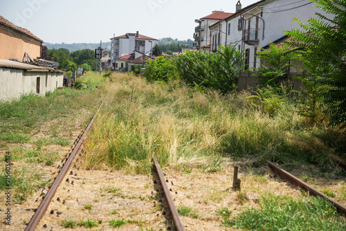 Abandoned secondary railway tracks and disused Canelli station in Canelli, Piedmont, Italy.