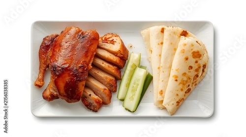 Sliced Roasted Peking Duck Served with Thin Pancakes, Cucumbers, and Spring Onions Isolated on White Background
