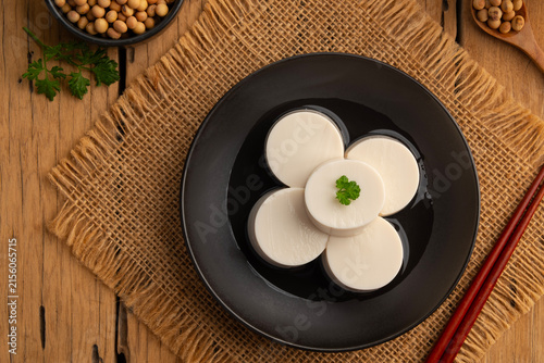 Fresh Sliced Soft Tofu soy bean curd,White Tube Tofu in black plate.
