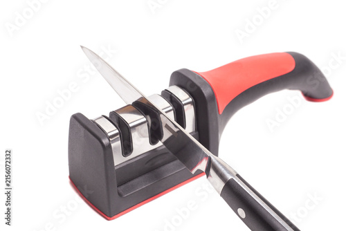 Manual new knife sharpener and knife isolated on white.