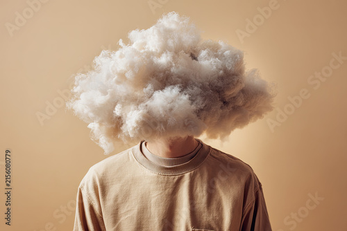 man head hidden by soft cloud on blue background, mental health, brain fog  