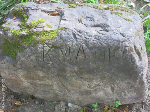Mysterious inscription on a large gray stone near the village of Novoselovo, Russia