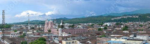 Panoramic View Of Guadalajara de Buga City With Pink Cathedral, Tiled Rooftops And Mountain Backdrop.