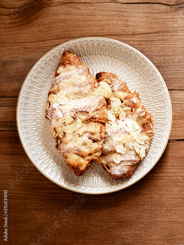 Almond Croissants with Powdered Sugar on Plate