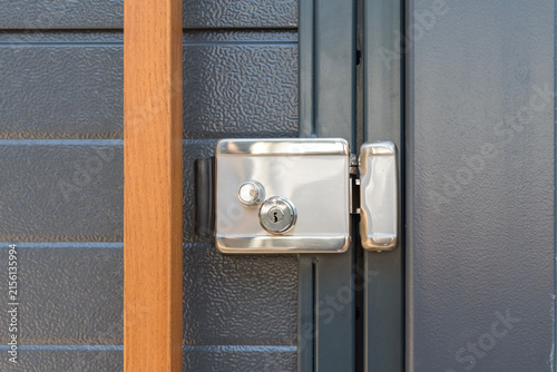Stainless steel electromechanical gate lock with keyhole and strike plate