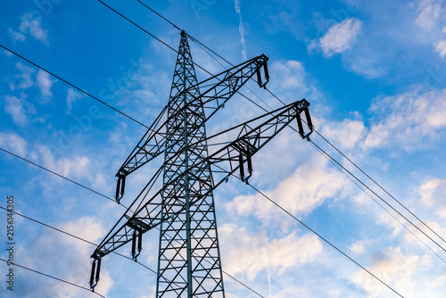 High voltage metal transmission tower, power lines and electricity pylons against sky electrical network, Sustainable energy infrastructure and power supply concept, industrial scenery, power station