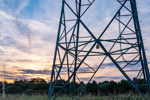 High voltage metal transmission tower, power lines and electricity pylons against sky electrical network, Sustainable energy infrastructure and power supply concept, industrial scenery, power station