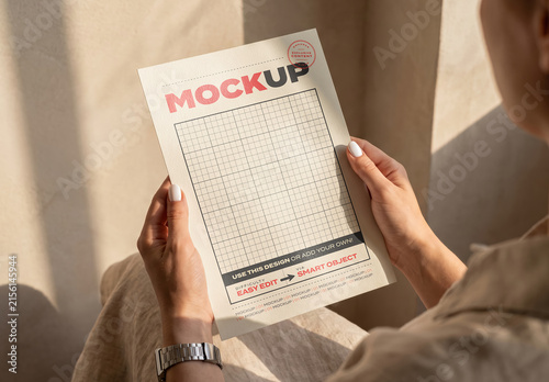Person Holding Page Flyer Mockup