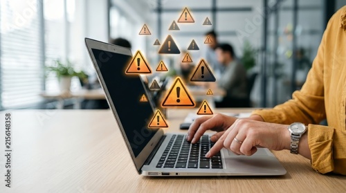 User typing on laptop surrounded by warning triangle icons representing cybersecurity risk alert system threat and error control