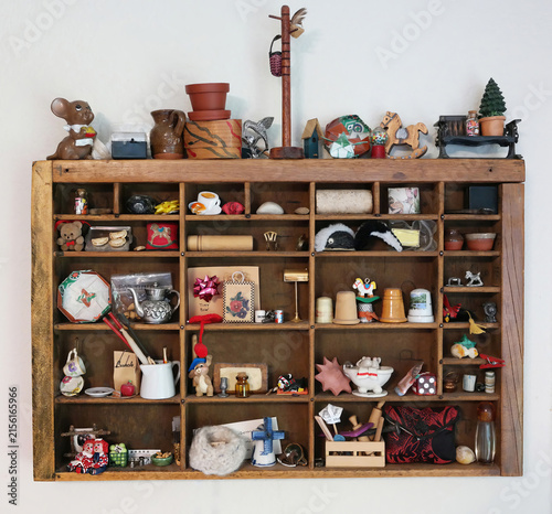 Fotografie Wooden Display Shelf Filled With Vintage Collectibles, Miniatures, Knickknacks A