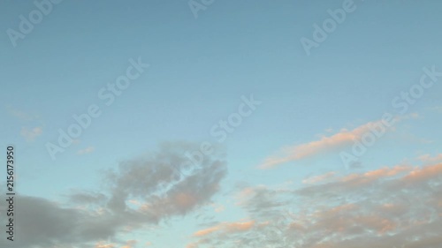 HD quality timelapse video of cloudscape in clear blue evening sky background in sunset evening time. Time lapse