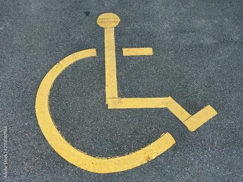 Close-up photo of a painted disabled sign, in the disabled parking space near the shopping mall