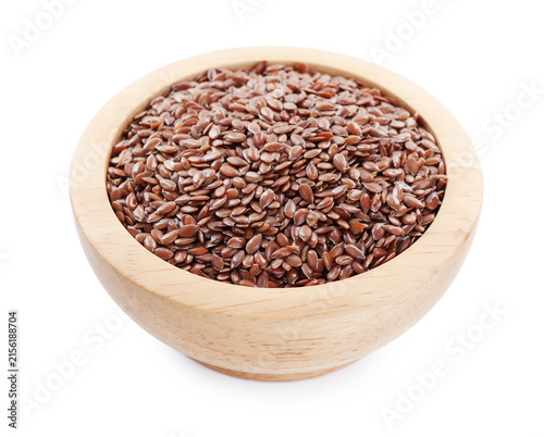 Flax seeds in wooden bowl isolated on white