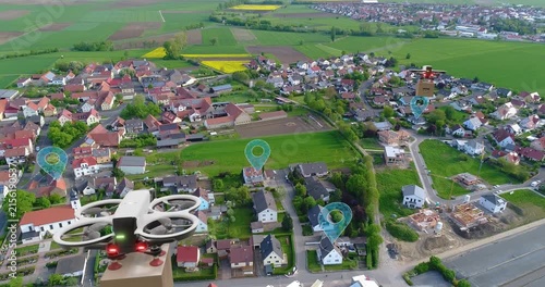 Futuristic City Concepts: A Look At The Next Generation Of Cities. An aerial cargo drone carries a cardboard box to a customer. A delivery drone flies over a city and delivers a package.
