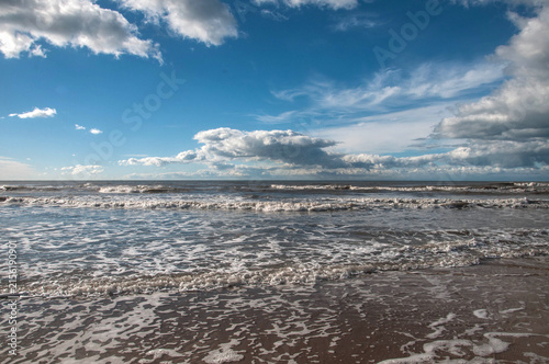 winter landscape with beach and clouds