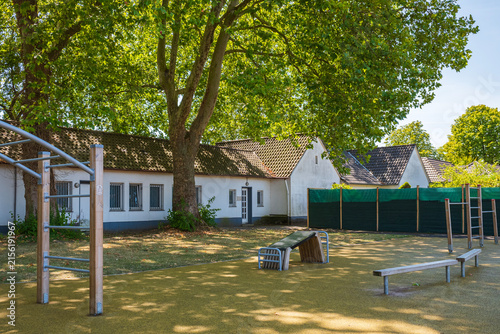 Fotografie Modern outdoor fitness and calisthenics workout station in a public park yard un
