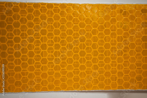 Yellow and Amber Reflective Safety Tape Patterns Close-Up