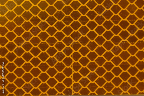 Yellow and Amber Reflective Safety Tape Patterns Close-Up