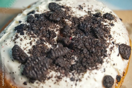 Принти на полотні Delicious Cookies and Cream Donut with White Glaze and Crumbled Topping