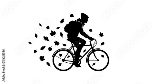 Silhouette of a person riding a bicycle with autumn leaves