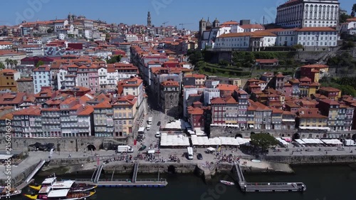 Porto, Portugal cityscape with the Douro River and historic bridges, featuring the Infante Bridge and Maria Pia Bridge, surrounded by traditional Portuguese architecture and scenic urban landscape.