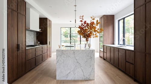 Modern Walnut Kitchen with Marble Island and Fall Foliage Centerpiece
