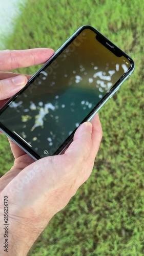 Hand holding a new cell phone to set up