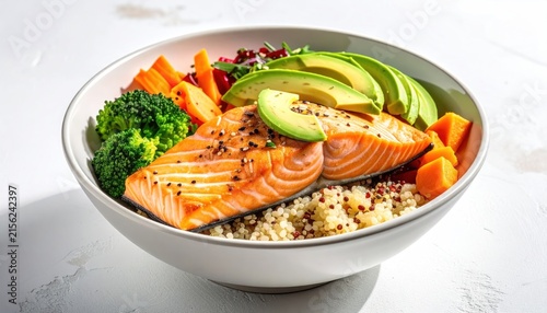 Grilled salmon bowl with quinoa, avocado, and vegetables.