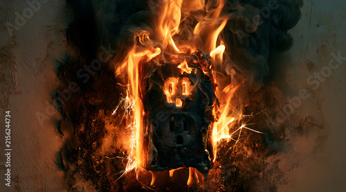 A close inspection of an electrical outlet ablaze reveals severe burns and a heightened risk of electrical fire.