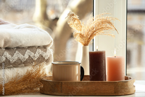Tray with burning candles, ...