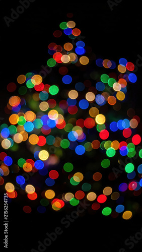 Christmas tree light bokeh colorful holiday decoration abstract dark background christmas tree light bokeh colorful holiday decoration abstract dark background glowing circle Christmas Concept