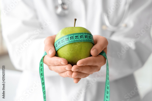 Female nutritionist with ap...