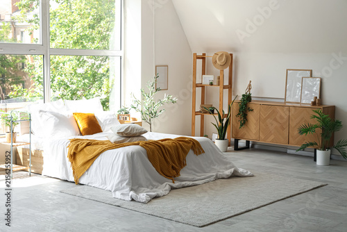 Interior of light bedroom w...