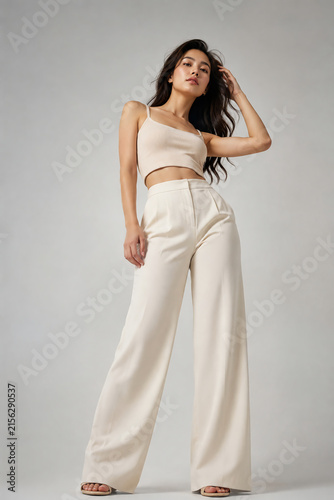 beautiful asian woman in elegant beige two piece set crop top